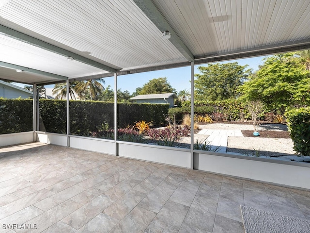 unfurnished sunroom featuring plenty of natural light