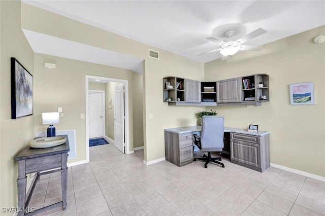 home office with light tile patterned flooring, baseboards, and visible vents