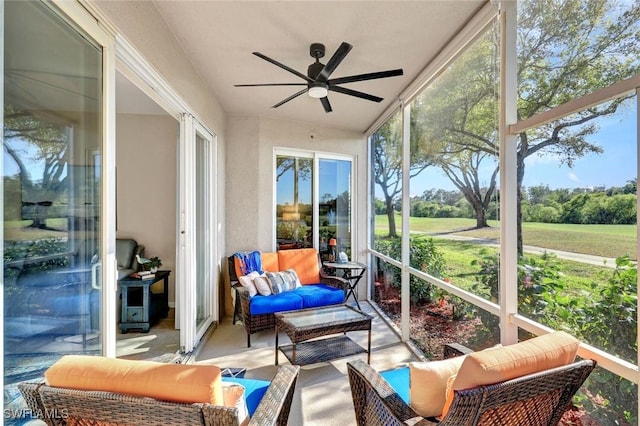 sunroom / solarium with ceiling fan