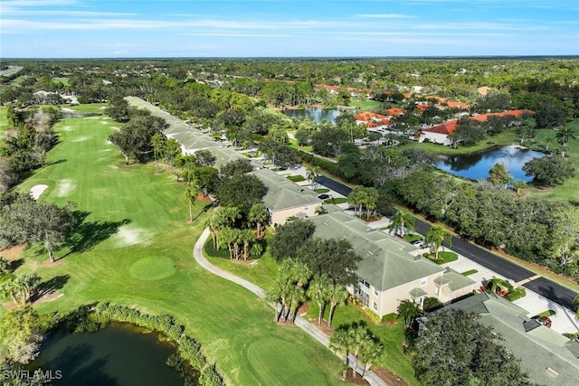 drone / aerial view featuring golf course view and a water view