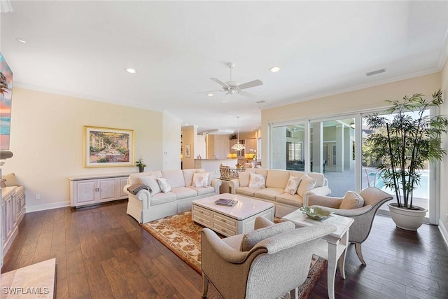 living room with baseboards, dark wood-type flooring, ornamental molding, and a ceiling fan