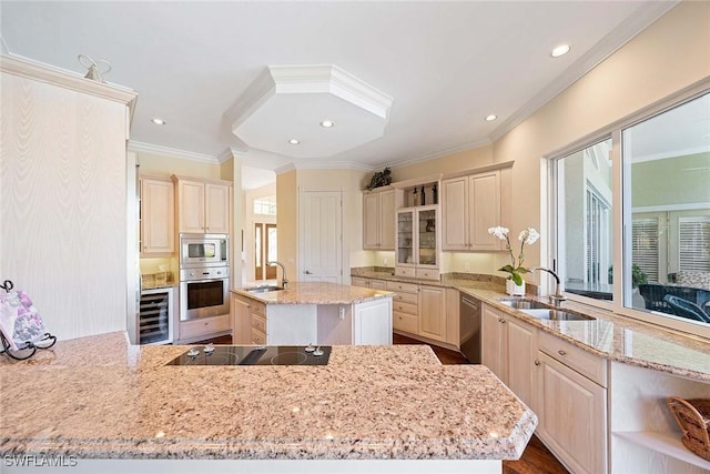 kitchen with a sink, stainless steel appliances, wine cooler, and light stone countertops