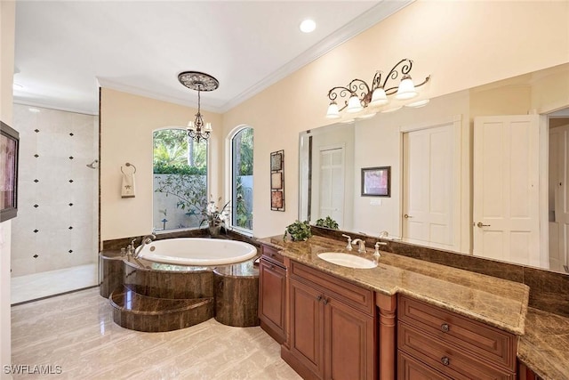 bathroom featuring vanity, an inviting chandelier, a tile shower, ornamental molding, and a garden tub