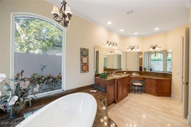 bathroom featuring ornamental molding, a tub with jets, and a healthy amount of sunlight