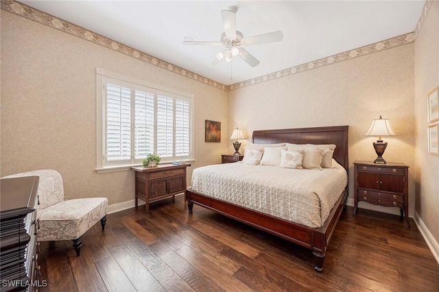 bedroom featuring hardwood / wood-style flooring, a ceiling fan, and baseboards