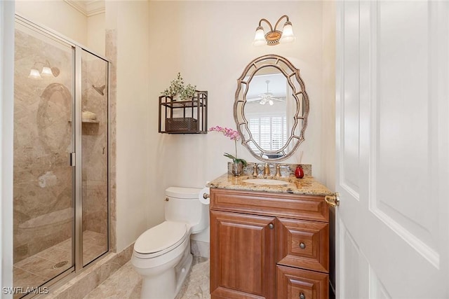 full bath with vanity, toilet, and a stall shower