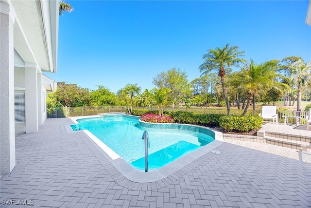 view of pool with a patio area, a fenced in pool, and fence