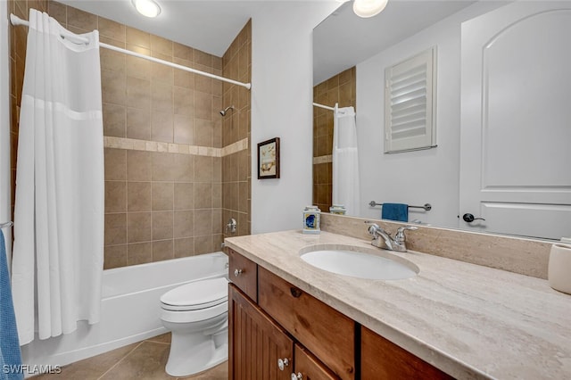 full bathroom featuring tile patterned floors, toilet, shower / bath combo with shower curtain, and vanity