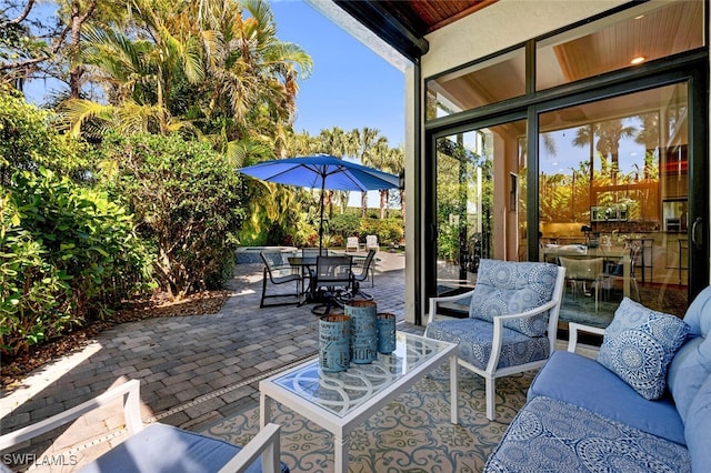 view of patio with outdoor dining space and an outdoor hangout area