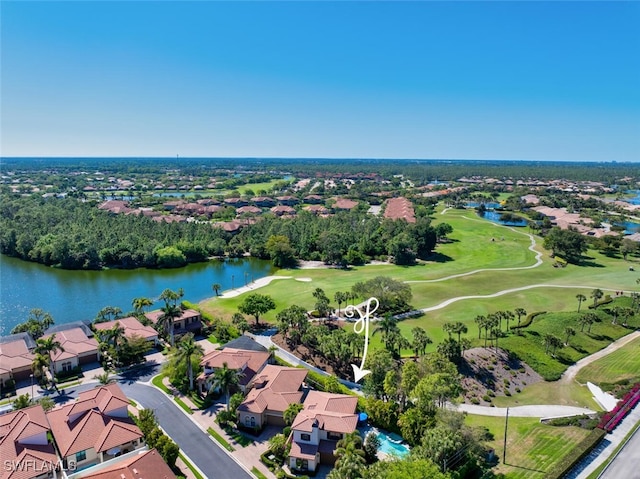 drone / aerial view with a residential view, golf course view, and a water view