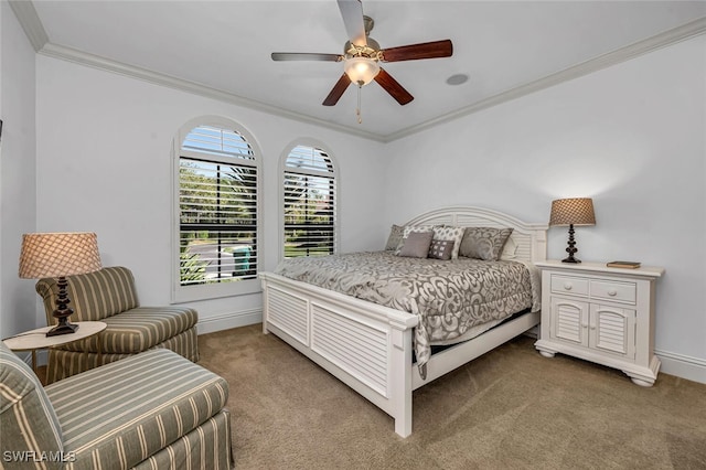 bedroom featuring ceiling fan, baseboards, ornamental molding, and carpet flooring