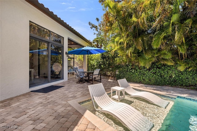 view of patio featuring outdoor dining space