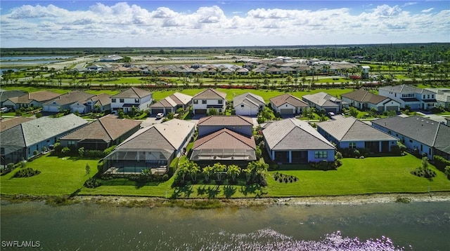 aerial view featuring a residential view and a water view