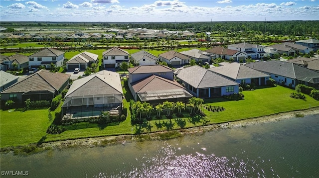 bird's eye view with a residential view and a water view