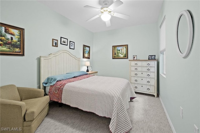 bedroom featuring ceiling fan, baseboards, and carpet floors