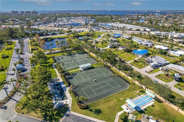 birds eye view of property with a water view