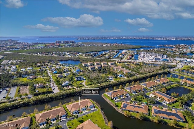 drone / aerial view featuring a water view and a residential view