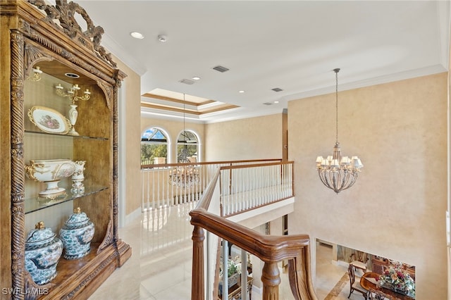 hall featuring crown molding, an upstairs landing, visible vents, and a chandelier