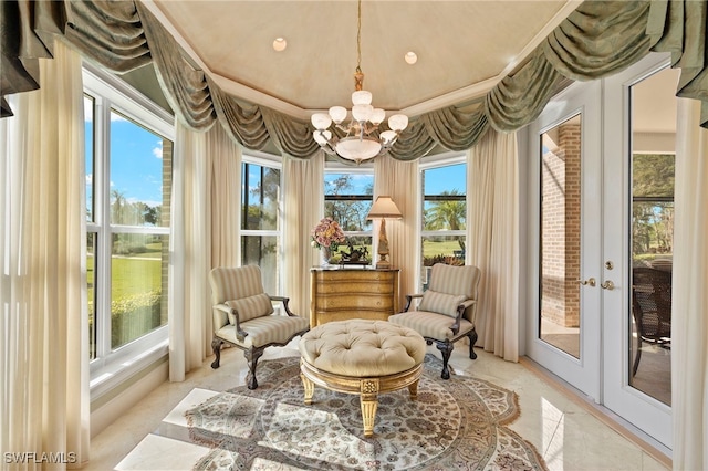 sitting room featuring an inviting chandelier