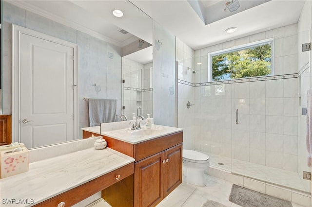 full bath with toilet, a stall shower, vanity, and crown molding