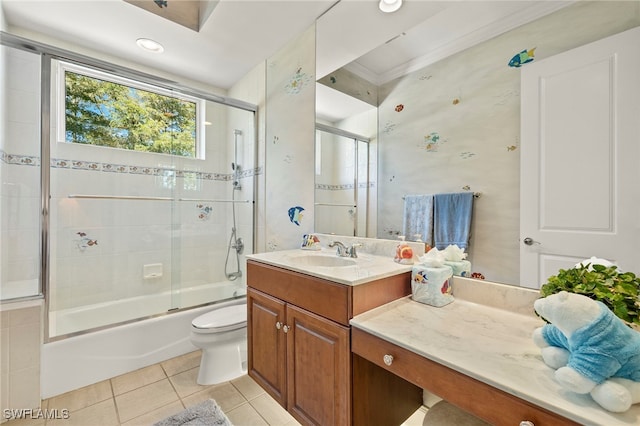 full bath featuring tile patterned flooring, toilet, vanity, and enclosed tub / shower combo