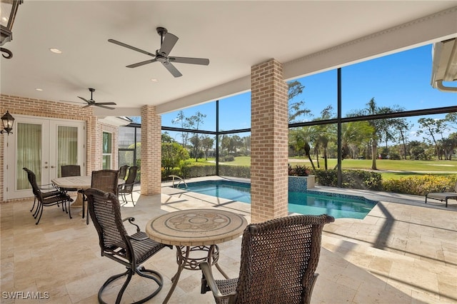 outdoor pool featuring a lanai, ceiling fan, french doors, and a patio