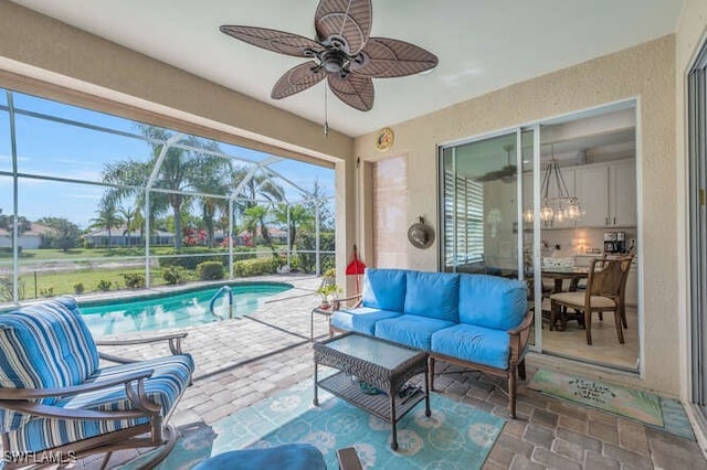 view of patio / terrace featuring an outdoor pool, a ceiling fan, a lanai, and outdoor lounge area