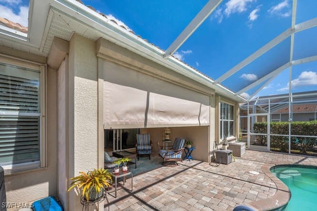 view of patio with a lanai and an outdoor pool