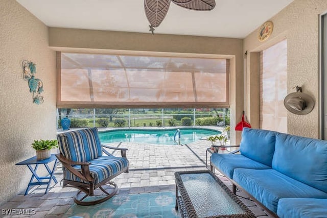 view of pool featuring a ceiling fan