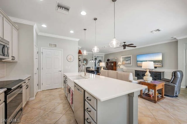 kitchen with visible vents, open floor plan, and stainless steel appliances