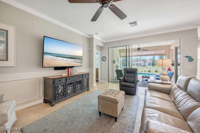 living room featuring visible vents, ceiling fan, and ornamental molding