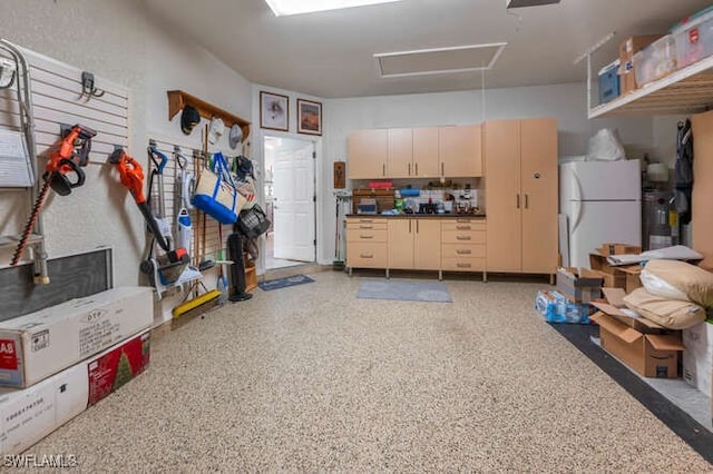 garage featuring freestanding refrigerator