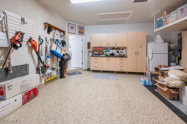 garage with freestanding refrigerator