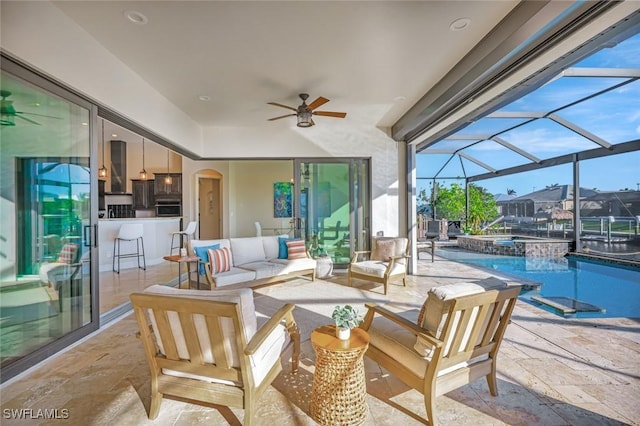 view of patio / terrace with glass enclosure, an outdoor hangout area, a pool with connected hot tub, and ceiling fan