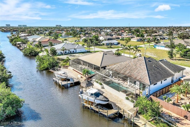 aerial view with a residential view and a water view