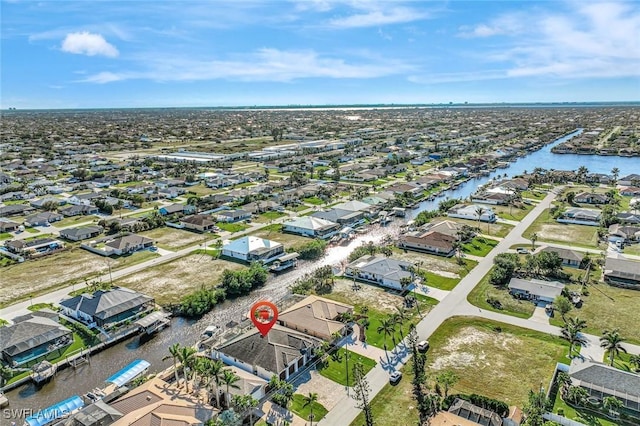 aerial view featuring a residential view and a water view