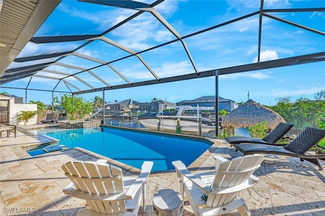 view of pool featuring a lanai, a patio area, a dock, and a pool with connected hot tub