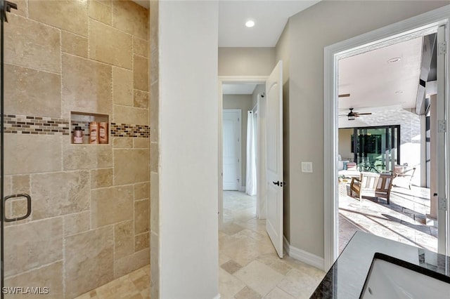 full bath with recessed lighting, baseboards, a stall shower, and stone finish floor