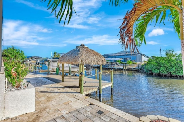 dock area with a water view and boat lift