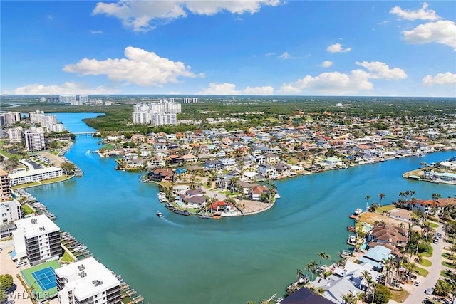 birds eye view of property featuring a view of city and a water view