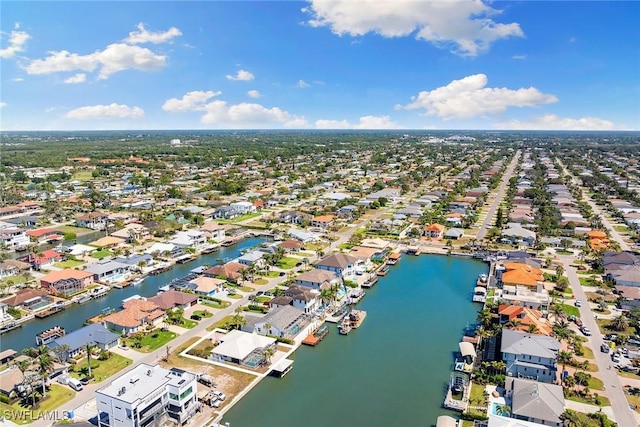 bird's eye view with a residential view and a water view