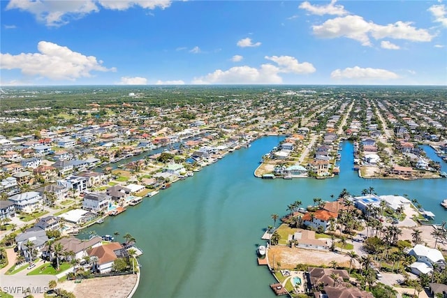 birds eye view of property with a residential view and a water view