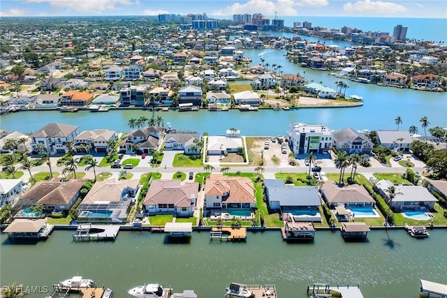 bird's eye view featuring a water view and a residential view