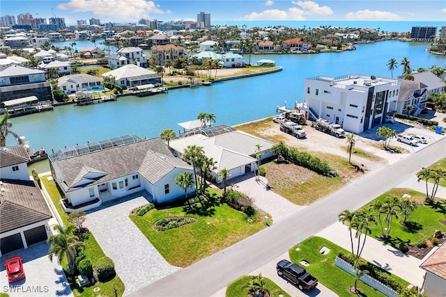 birds eye view of property with a water view