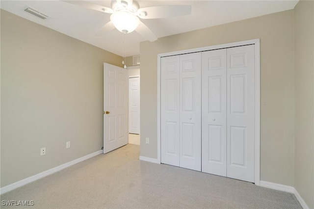 unfurnished bedroom with light colored carpet, visible vents, and baseboards