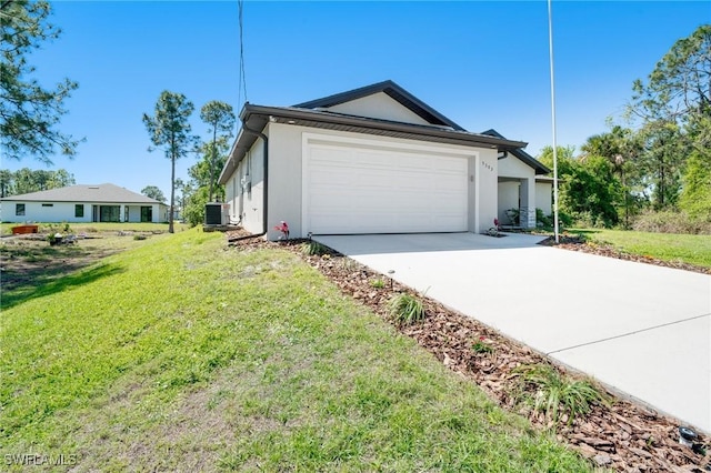 view of property exterior featuring stucco siding, driveway, a yard, and an attached garage