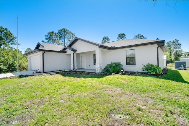 single story home with a front yard, central AC unit, an attached garage, stucco siding, and concrete driveway