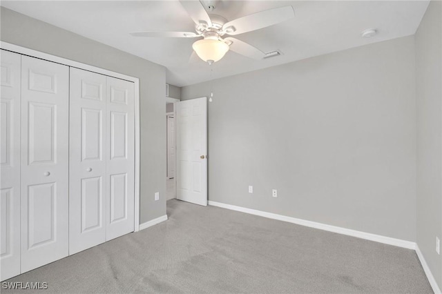 5303 4th St W, Lehigh Acres, FL 33971 - unfurnished bedroom with carpet flooring, a closet, and a ceiling fan