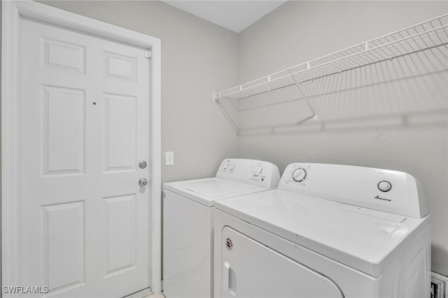 washroom featuring washer and dryer and laundry area