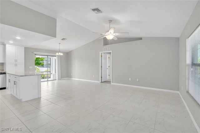 unfurnished living room with visible vents, baseboards, vaulted ceiling, and ceiling fan with notable chandelier